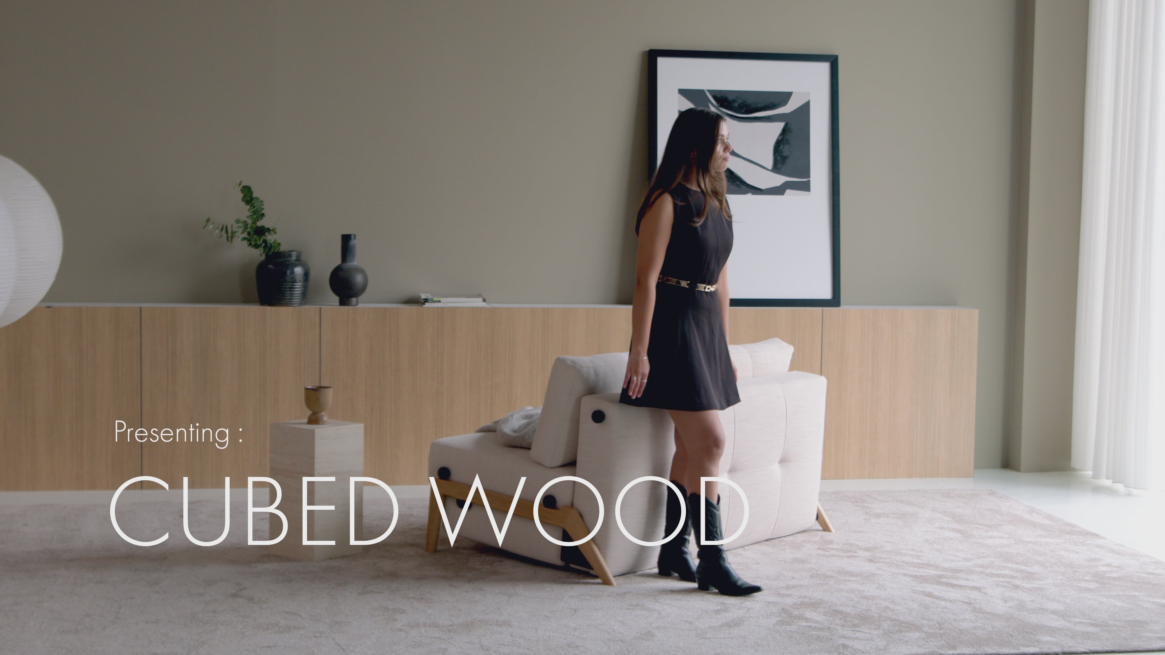 Load video: Cubed Sofa Bed with Wood Legs